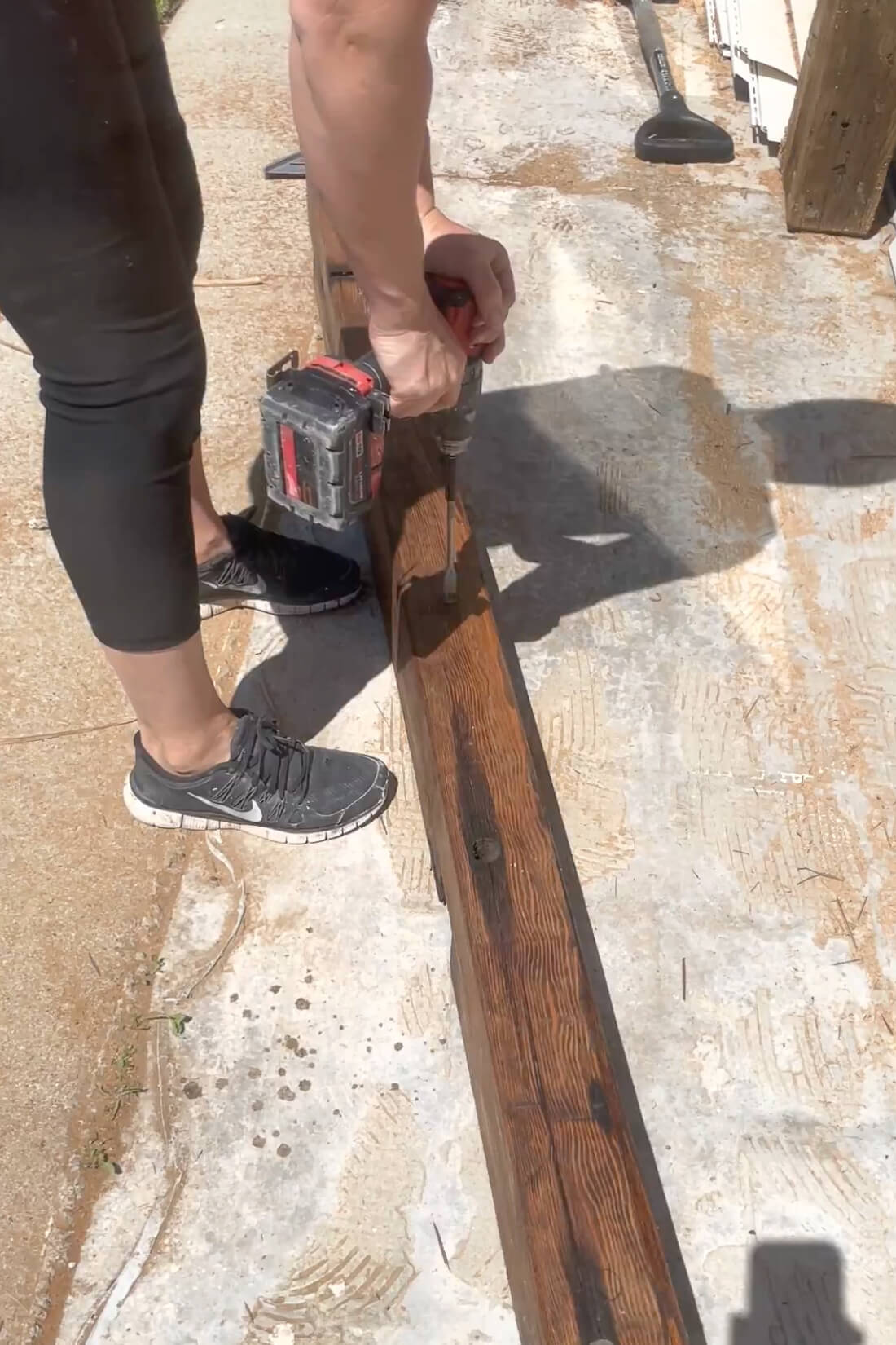 Drilling holes for mounting mantle to fireplace surround.